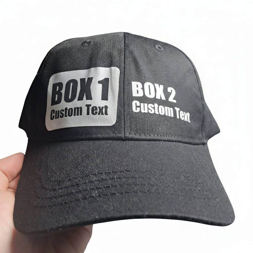 A black baseball cap. featuring a white rectangular patch with the custom text word and second section for more custom text